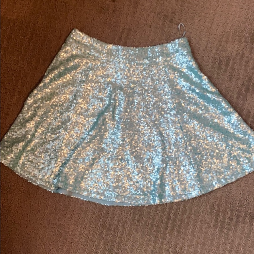Turquoise skirt with sequins.